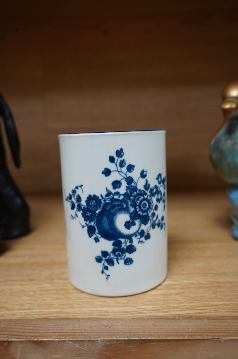 A Worcester blue and white porcelain mug, c.1775, 11.5cm high. Condition - fair to good.